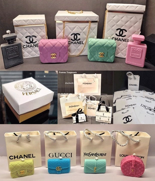 Miniature luxury brand bags and perfume bottles featuring Chanel, Versace, Gucci, and Dior.